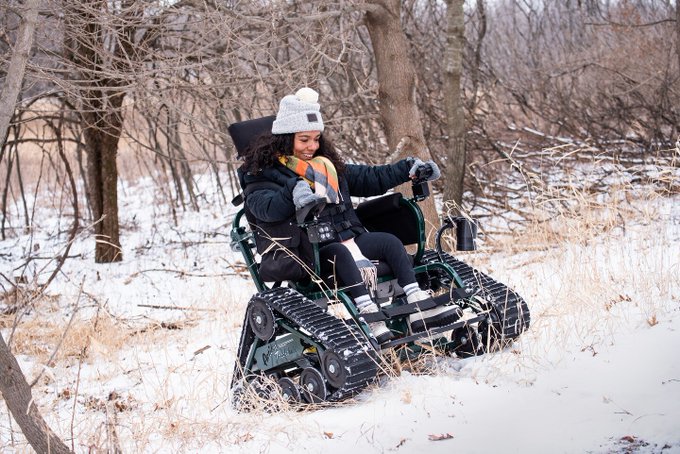 Brittanie Wilson traverses the snow in a track chair at Minnesota's Myre-Big Island State Park in Minnesota. Photo courtesy of Washington Post: All-terrain wheelchairs arrive at U.S. parks: ‘This is life-changing’ washingtonpost.com 