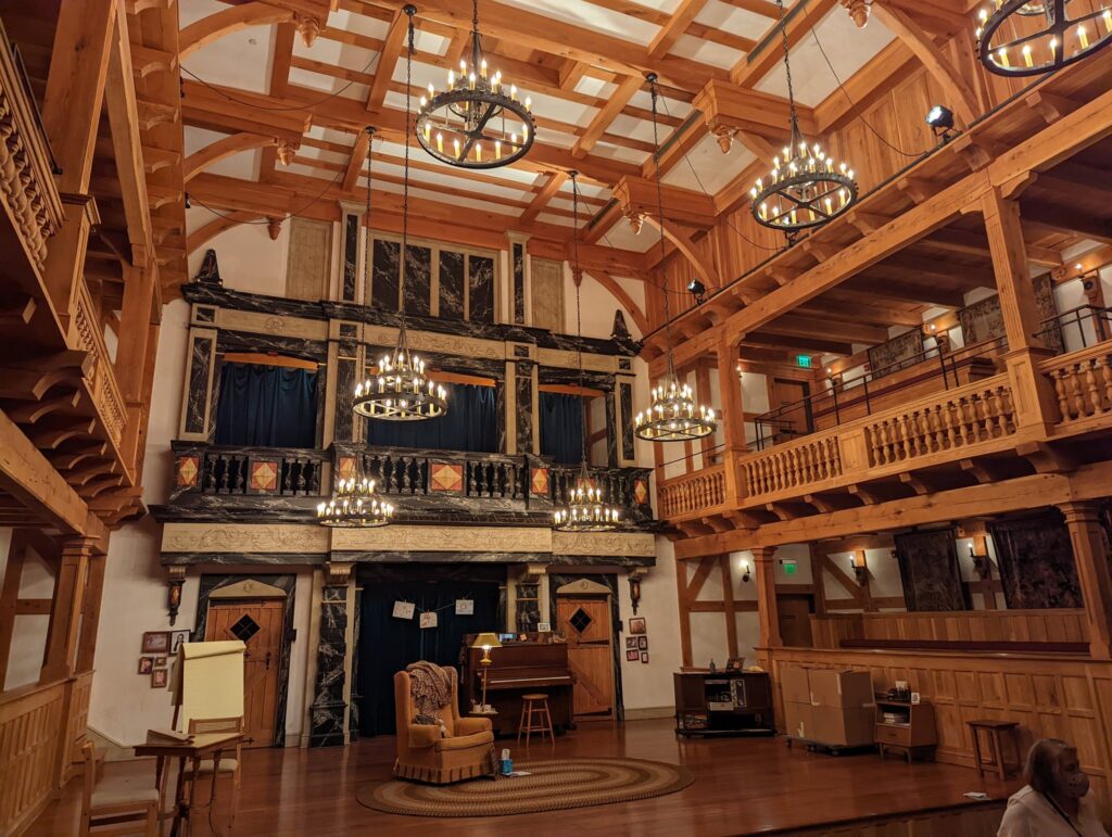 Photograph of the stage at the Blackfriars Playhouse, and the balcony seats that surround it. The intricate detail of the timber framed design, mirroring a Shakespearean roundhouse, only adds to the ambience of enjoying a play here. it is, like stepping back into Shakespeare's time.