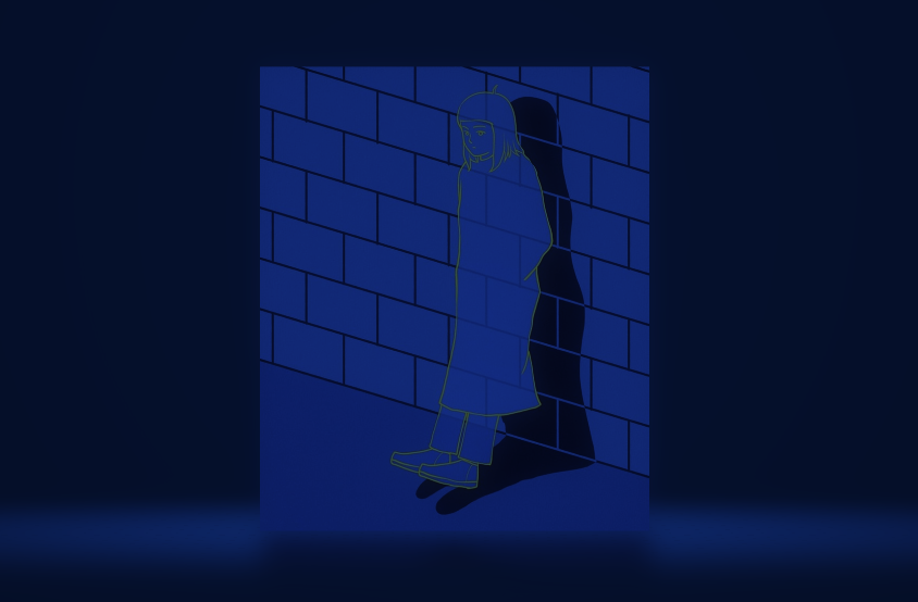 Illustration shows a lone figure in a long trench coat, leaning against a brick wall. The the solitary figure's features are outlined in a somber grey, as their night black shadow, is cast on the wall behind. The entire image is bathed with indigo.