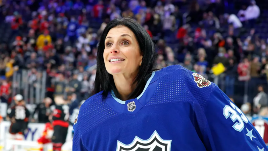 Photograph of women's rights and hockey legend Manon Rhéaume participating in the 2022 NHL All-Star game she's wearing a Tampa Bay Lightning blue colored NHL All-Star jersey with the number 33, the same she wore in her time with the Lghtning.